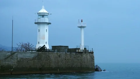 View of the lighthouse standing on the coast in Yalta, Crimea Stock Footage 84808019