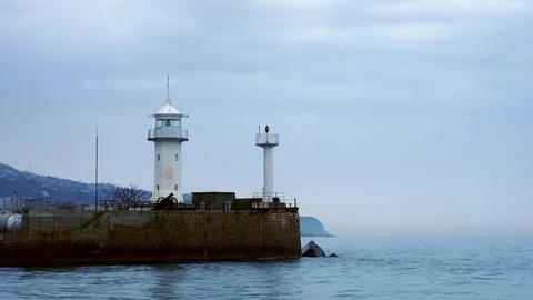 View of the lighthouse standing on the coast in Yalta, Crimea Stock Footage 84808022
