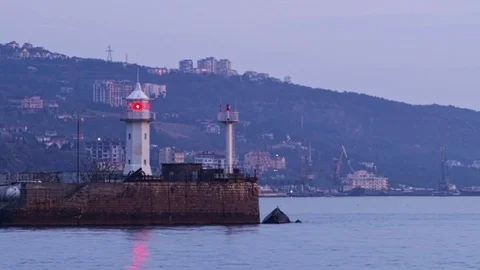 View of the lighthouse standing on the coast in Yalta, Crimea Stock Footage 84808113