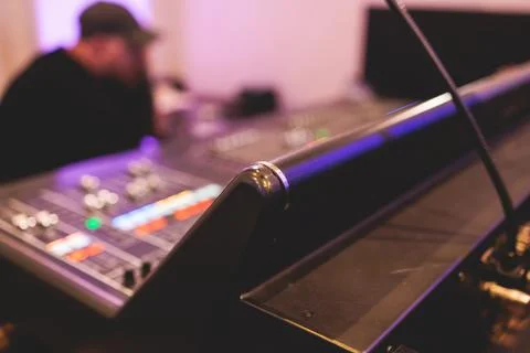 View of lighting engineer operator working on mixing console workplace duri.. Stock Photos