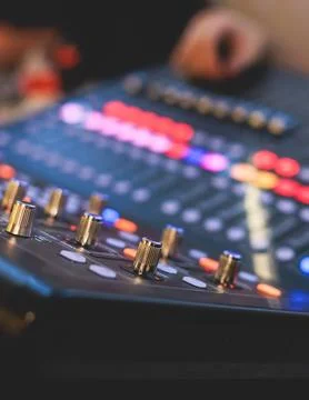 View of lighting technician operator working on mixing console workplace du.. Stock Photos