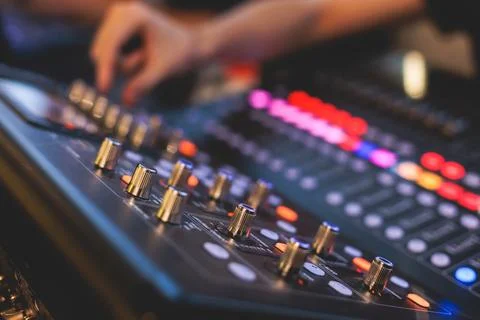 View of lighting technician operator working on mixing console workplace du.. Fotos de archivo