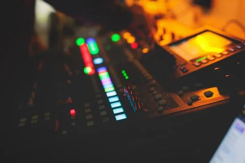 View of lighting technician operator working on mixing console workplace du.. Stock Photos