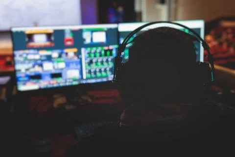 View of lighting technician operator working on mixing console workplace du.. Stock Photos