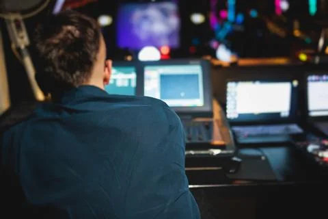 View of lighting technician operator working on mixing console workplace du.. Stock Photos