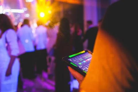 View of lighting technician with tablet, operator controlling sound and lig.. Stock Photos