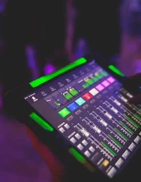 View of lighting technician with tablet, operator controlling sound and lig.. Stock Photos