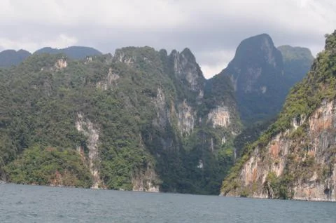 View of limestone cliffs from the water, khao sok national park, Thailand Stock Photos