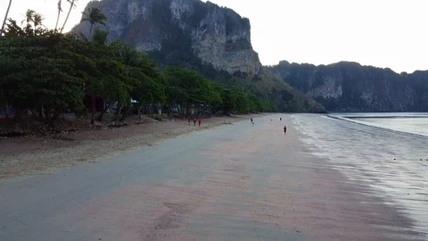View on limestone rocks and Adaman sea sunset in Ao Nang beach town Stock Footage 129572489