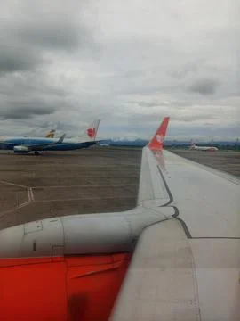 A view of Lion air's wing during its preparation to take off Stock Photos