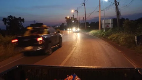View from the load space of a moving pickup truck at night traffic Stock Footage 299652863