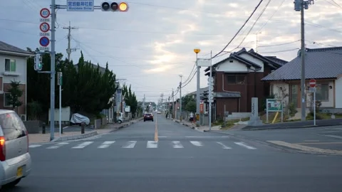 View at the local traffic intersection with some cars traffic in sunset day.. Stock Footage 248197589