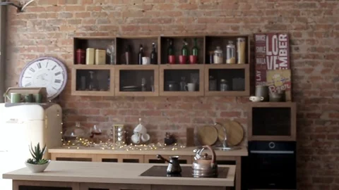View of a loft style kitchen with a large table Stock Footage 101818423
