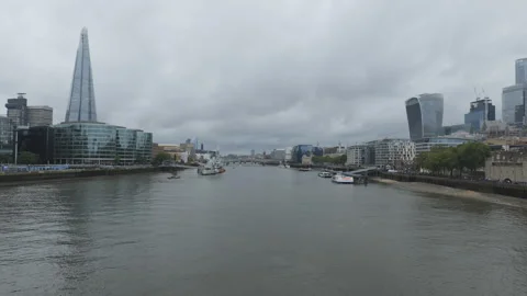View of London’s skyline over the Thames on a cloudy day. Stock Footage 312295105