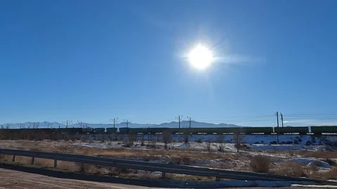 View of a long moving train with freight cars Stock-Footage 230611704