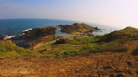 View of look out to geological formation Waiting Husband Reef and ocean horizon  Stock Footage 238499863