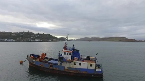 A view looking across Oban Bay, Oban, Scotland.Fishing trawler moored up in Video stock 92210072