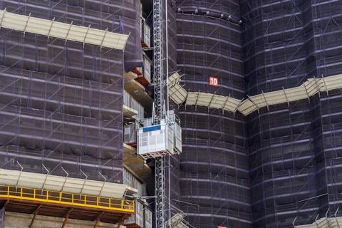 View looking up at a building under construction made of concrete scaffolding Stock-Fotos
