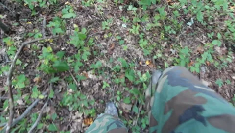 View looking down at hunters feet walking through the woods(HD) c Stock Footage 8655546