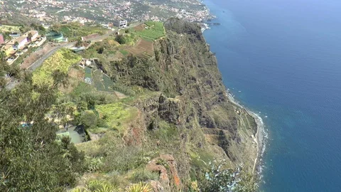 View Looking Down Rocky Cliff Towards Sea at Cabo Girao Stock Footage 127280637