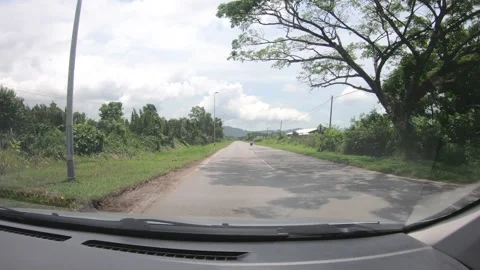  View Looking Forwards From Inside A Car Driving Along rural small town Stock-Footage 107316922