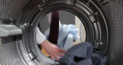 View Looking Out From Inside Washing Machine Filled With Laundry. Loading col Stock Footage 152855679