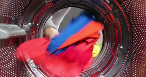 View Looking Out From Inside Washing Machine Filled With Laundry. Loading col Stock Footage 152855829