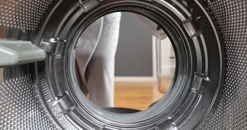 View Looking Out From Inside Washing Machine Filled With Laundry. Loading col Stock Footage 152856213