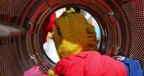 View Looking Out From Inside Washing Machine As boy Puts In Laundry Load. A y Stock-Footage 152857716
