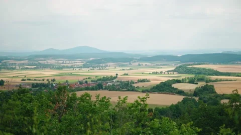View Looking Over Patch Work Fields In Rural Bad Königshofen In Bavaria Stock Footage 227628607