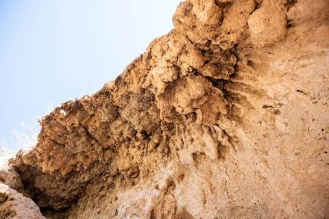A view looking up at a rocky surface where the texture of the stones Stock Photos