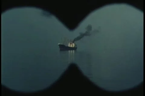 View looking through binoculars at black smoke coming from ship Stock-Footage 11349370