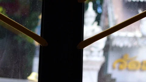 View of looking through the bus windows at the Chingmai city Stock Footage 117927554