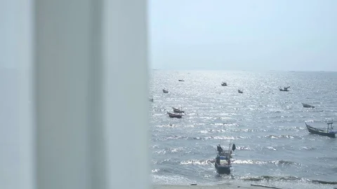 The view looks through the curtains. See the sea from the room Stock Footage 128671955