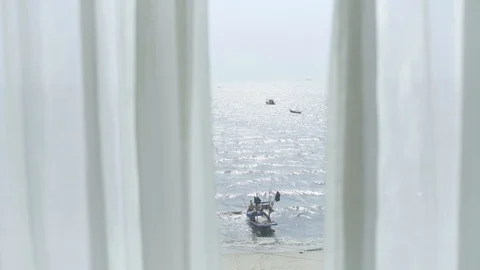 The view looks through the curtains. See the sea from the room Stock Footage 128672015
