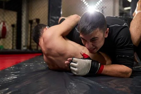 View of low angle of two professional fighters battling in gym. Strong boxers Fotos de archivo