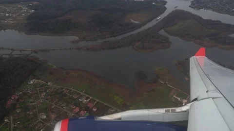 View from a low-flying plane on the wing and the turbine Stock Footage 134576228