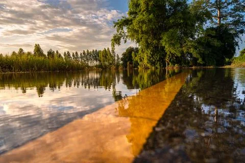 A view from a low vantage point on a flooded road Stock Photos
