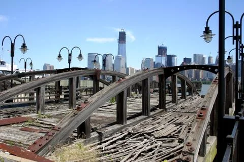 A view of lower Manhattan seen over a dilapidated pier in New Jersey Stock Photos