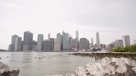 View of Lower Manhattan skyline and tourist kayaking in Hudson River Stock-Footage 53776393