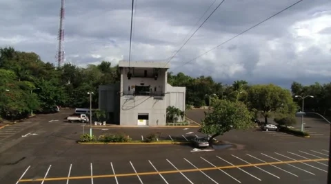 View to the lower station of the cable car from the departing gondola. Video stock 58355771