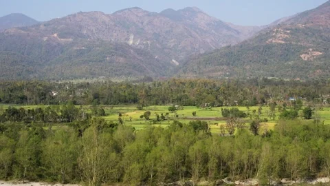 View of lush green fields and mountains, Nepal. Vídeos de archivo 335604148