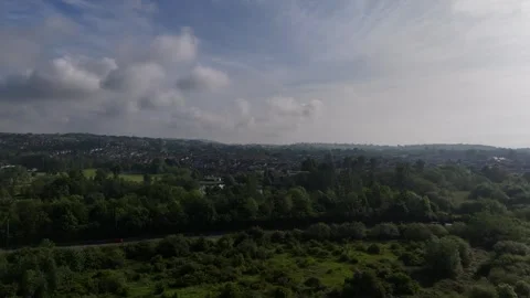 View of Lydney and the wider Forest of Dean Gloucestershire rising aerial Stock Footage 294923196
