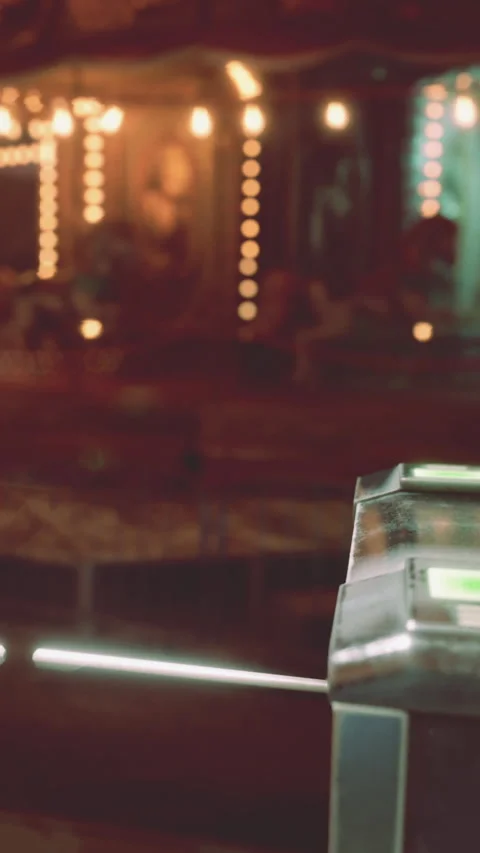 View of machine at carnival during night time with lights in background 스톡 동영상 339040218