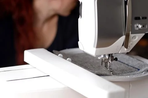 View on machine head of a modern sewing machine with embroidery unit Stock Photos