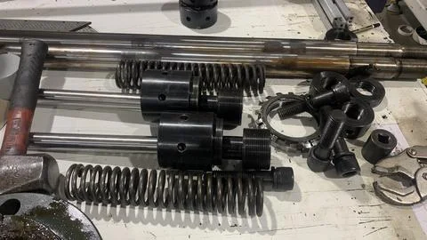 View of machine industry items such as gears and shafts Stock Photos