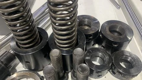 View of machine industry items such as gears and shafts Stock Photos