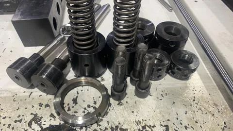 View of machine industry items such as gears and shafts Stock Photos