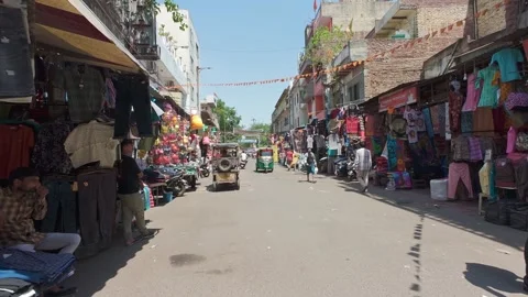 View of the Main Bazaar street leading to the New Delhi Railway Junction Stock Footage 336662864