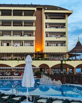 View of the main building of the Utopia World Hotel in the evening Stock-Fotos